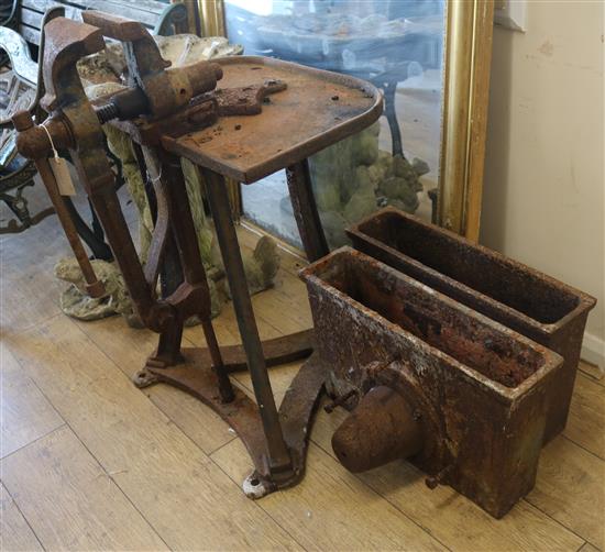 A vice bench and a pair of iron cisterns Vice W.59cm and cistern W.58cm